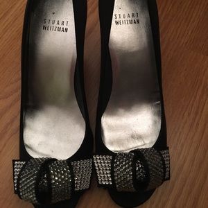 Black satin Stuart Weitzman heels with bow detail